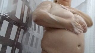 Naked stepmom with big tits and ass takes a shower