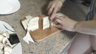 Sexy mommy MILF Frina continues her nude cooking. Without panties and bra high heels in kitchen Milf prepares delicious vegetarian appetizer of pita bread and champignons with sauce. Pussy Ass Big natural tits MILF