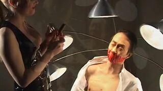 Dominant whore restrains sub guy and tortures his little cock and balls