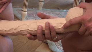 The blonde milf spreads her wet pussy for a hard and strong