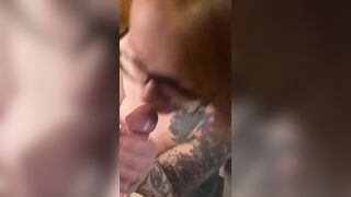 Hot redhead wearing glasses gets a facial