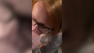 Hot redhead wearing glasses gets a facial
