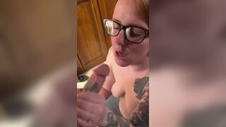 Hot redhead wearing glasses gets a facial