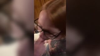 Hot redhead wearing glasses gets a facial