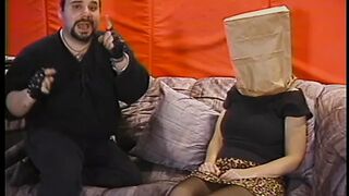 Chubby whore with paper bag on head has her jugs and cunt