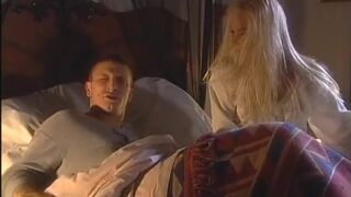 Sexy blondie gives a huge cock a blowie on the big bed - 3 image