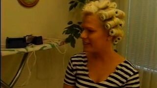 Blonde mulf sucks down a huge cock on her knees