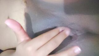 Ebony milf stimulates her clit and plays with her newly shaved pussy