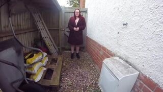 Chubby redhead in the Yard in Ankle boots and coat