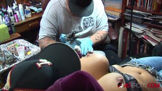 Shyla Stylez gets tattooed while playing with her tits