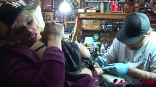 Shyla Stylez gets tattooed while playing with her tits