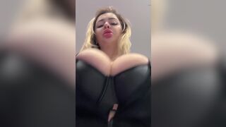 Big natural tits bursting out elastic leather - 2 image