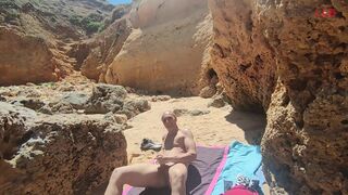 Blowjob with cumshot on a crowded beach...