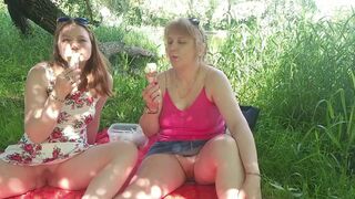 Konstanzia and Assol26: Two MILFs with panties & ice cream get kinky with each other in public - 8 image