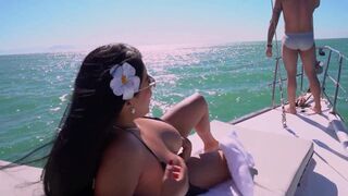 Watch Big Jackson's big natural tits bounce as he pounds a young man on Rio yacht! - 1 image