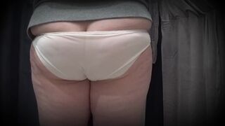 In a fitting room in a public store, the camera caught a chubby milf with a gorgeous ass in transparent panties. PAWG.