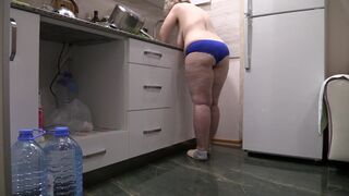 BBW MILF housewife in the kitchen wearing only panties.