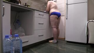 BBW MILF housewife in the kitchen wearing only panties.