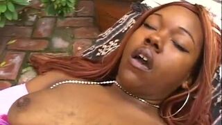 Two ebony lesbians fucking with dildos outdoors - 2 image