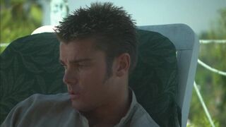 Romantic couple make out passionately by the poolside