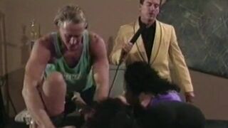 Two guys fuck two girls side by side during a presentation