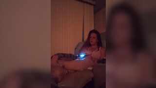 Cute busty Gamer girl playing Fortnite in dress