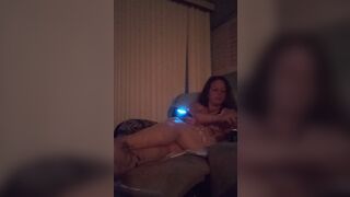 Cute busty Gamer girl playing Fortnite in dress